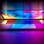 A laptop computer with a bright, colorful screen on a desk
